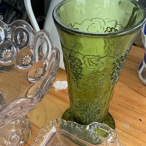 Vintage green vase with fruit design on it. Great condition